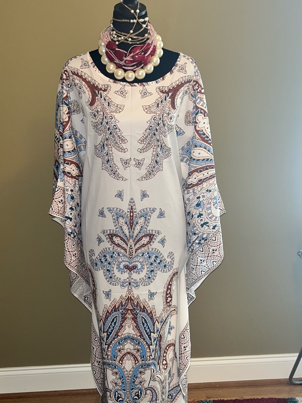 White Elenzga batwing- sleeve maxi kaftan. Blue and brown paisley print.